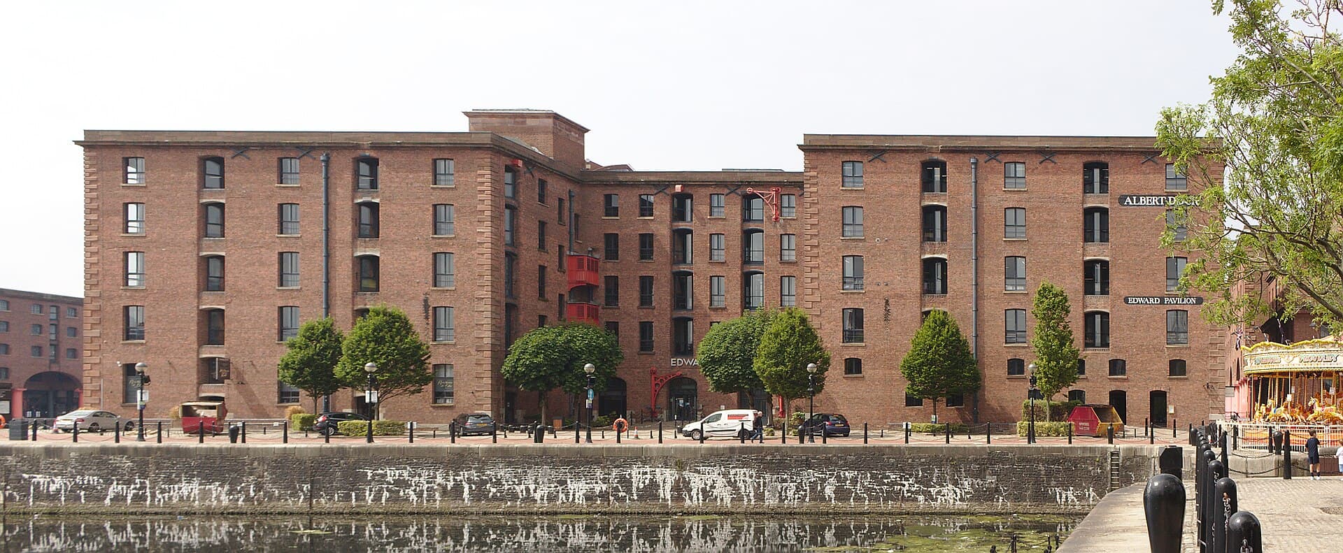 The red-brick warehouses of Liverpool's Royal Albert Dock reflected in the water