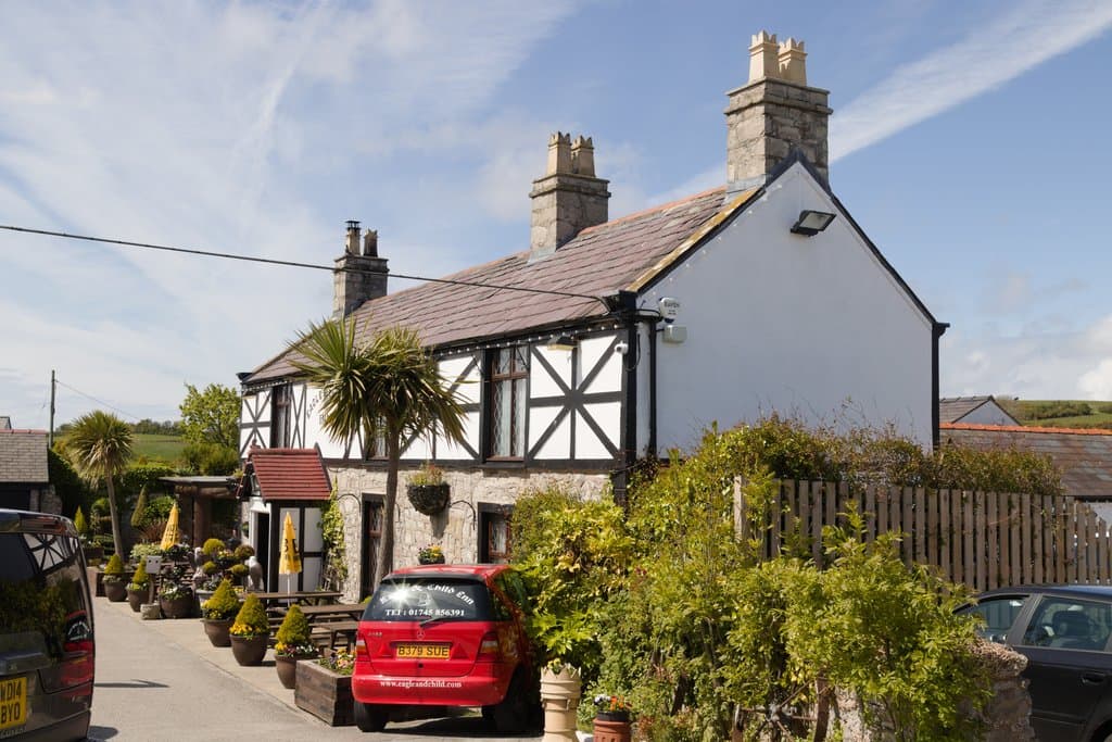 The Eagle & Child at Gwaenysgor, a traditional stone and timbered village inn with a sunny beer garden