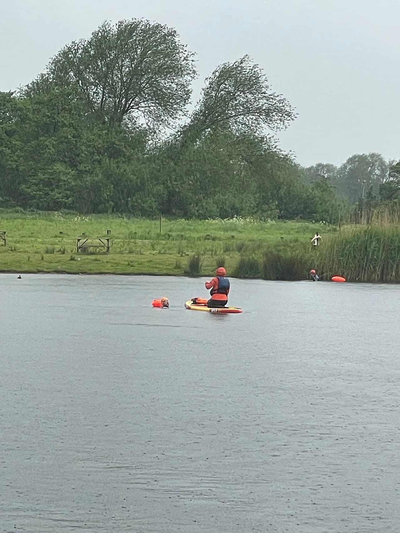 A paddleboarder out on the open lake at Park in the Past